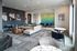 Contemporary lounge area with elegant decor, modern furniture, and vibrant artwork creating a welcoming atmosphere.