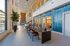 Luxurious modern lobby with high ceilings, stylish lighting, and a sleek reception area.