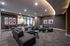 Luxurious and spacious living area featuring stylish decor, contemporary furniture, and vibrant artwork in a modern apartment.
