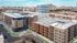 Modern urban apartment complex with sleek architecture, offering spacious living areas and stunning city views.