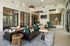Chic and inviting apartment lounge with plush seating, stylish decor, and abundant natural light.