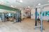 Modern fitness center with state-of-the-art equipment, bright lighting, and stylish decor for an invigorating workout experience.