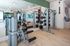 Sleek, modern gym with state-of-the-art fitness equipment and stylish decor, perfect for an invigorating workout.