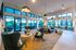 Luxurious communal lounge with modern design, featuring elegant seating, large windows, and ambient lighting, ideal for social gatherings.