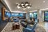 Contemporary lounge area featuring stylish furniture, modern lighting, and vibrant decor with a view of the cityscape.
