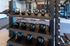 Modern fitness center with a sleek kettlebell rack and state-of-the-art equipment, offering an ideal workout space.