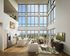 Luxurious open-concept living space with floor-to-ceiling windows, modern kitchen, and scenic views, perfect for entertaining.