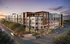 Modern apartment complex at sunset, featuring stylish architecture, vibrant landscaping, and convenient access with a welcoming leasing office.