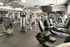 Modern gym with state-of-the-art exercise equipment, sleek design, and spacious layout, ideal for fitness enthusiasts.