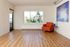 Bright and airy apartment living room with natural light and hardwood floors. .