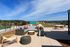 Stunning rooftop terrace featuring comfortable outdoor seating with panoramic views, ideal for relaxation and social gatherings.