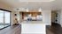 Modern kitchen with sleek appliances, spacious island, and elegant lighting, perfect for entertaining.