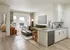Modern open-concept living space featuring a stylish kitchen with sleek cabinets, cozy living area with mountain views, and chic decor elements.