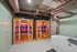 Luxurious apartment spa area featuring two elegant wooden saunas with ambient lighting and a modern soaking tub.