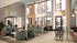 Chic modern lounge with high ceilings, stylish seating, and floor-to-ceiling windows offering abundant natural light.