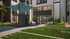 Modern outdoor area with sleek exercise equipment, vibrant landscaping, and stylish glass-paneled building facade.