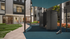 Modern apartment courtyard with stylish outdoor fitness station, lush greenery, and inviting indoor spaces.