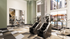 Modern fitness center with state-of-the-art gym equipment, sunny pool views, and motivational decor.