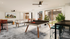 Vibrant game room with sleek table tennis and foosball tables, modern bar seating, and lush greenery, perfect for entertainment and relaxation.