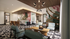 Contemporary living space with modern decor, abstract wall art, chic furniture, and a warm, inviting ambiance.