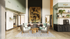 Elegant common area featuring modern armchairs, a stylish wooden coffee table, and striking artwork on the wall, perfect for relaxation and social gatherings.