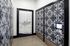 Stylish lobby featuring geometric patterned walls and sleek Atlas Blue Hill signage.