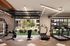 Modern fitness center with state-of-the-art gym equipment and open garage doors leading to a lush outdoor garden.