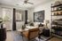 Chic modern living room with elegant decor, featuring a cozy white sofa, stylish artwork, and abundant natural light.