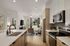Bright and modern open-concept living space featuring a sleek kitchen with stainless steel appliances, a cozy living area, and a glimpse of a serene bedroom.