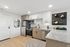Modern kitchen with sleek stainless steel appliances, elegant granite countertops, and stylish open shelving, perfect for contemporary living.
