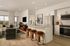 Modern open-concept living space with elegant kitchen, cozy seating area, and stylish decor.