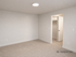 Modern 3D rendered empty room with soft carpet and walk-in closet door, perfect for customization.