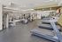 Apartments in Brooklyn Park, MN, with In-Unit Washer and Dryer - Urbana Court Apartments - Modern Fitness Center With Multiple Treadmills, Stationary Bikes, And Weight Equipment.