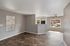Apartments in North Las Vegas, NV, with In-Unit Washer and Dryer - Topaz Springs - An Open Living Room With Wood Flooring, Gray Walls, And Large Windows With Blinds.