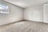 Aurora, CO, Pet-Friendly Apartments - Silverbrook - Spacious Carpeted Bedroom With Large Window, Soft Gray Walls, And Built-In Closet For Simple, Flexible Furnishing.