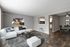 Two-Bedroom Apartments in Alsip, IL - Midpointe Apartments - A Living Room With White Sectional Sofa, a Round Coffee Table, and a Dining Space.