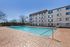 Alsip, IL, Pet-Friendly Apartments - Midpointe Apartments - Large Outdoor Swimming Pool With Brick Paver Deck, And Metal Handrails.