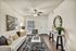 Pet-Friendly Apartments in North Austin, TX - Lotus Village Apartments - A Living Room With Sofa, Coffee Table, Ceiling Fan, And Accent Chair.