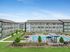 Apartment buildings with pool in view