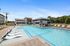 Pool with Tanning Shelf and Exterior Clubhouse