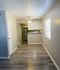 Open area with plenty space for your new dining set and bar stools.