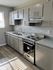 Galley style kitchen with stainless steel appliances