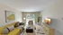 Bright, contemporary living room with a cozy yellow sofa, modern décor, and large window offering scenic garden views.