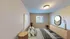 Cozy bedroom with soft lighting, modern decor, and a stylish window view creating a tranquil ambiance.