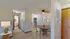 Inviting apartment interior with elegant dining area, chic artwork, and cozy lighting for a warm ambiance.