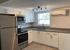 kitchen, counter tops, sink, stain steel appliances, white cabinets