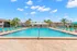 Sparkling Swimming Pool with Chaise Lounges