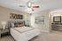 Large Bedroom with Ceiling Fan and Built-in Vanity