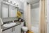 Bathroom with Framed Mirror and Extended Vanity