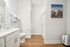 Luxury bathrooms featuring white cabinets and modern finishes.